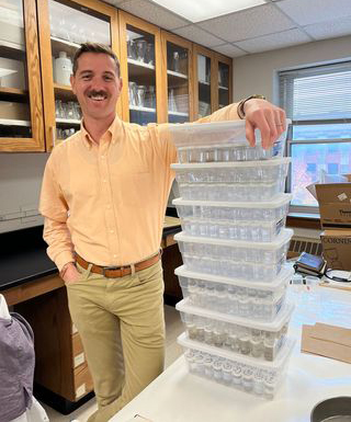 Jim Benes standing in Lab