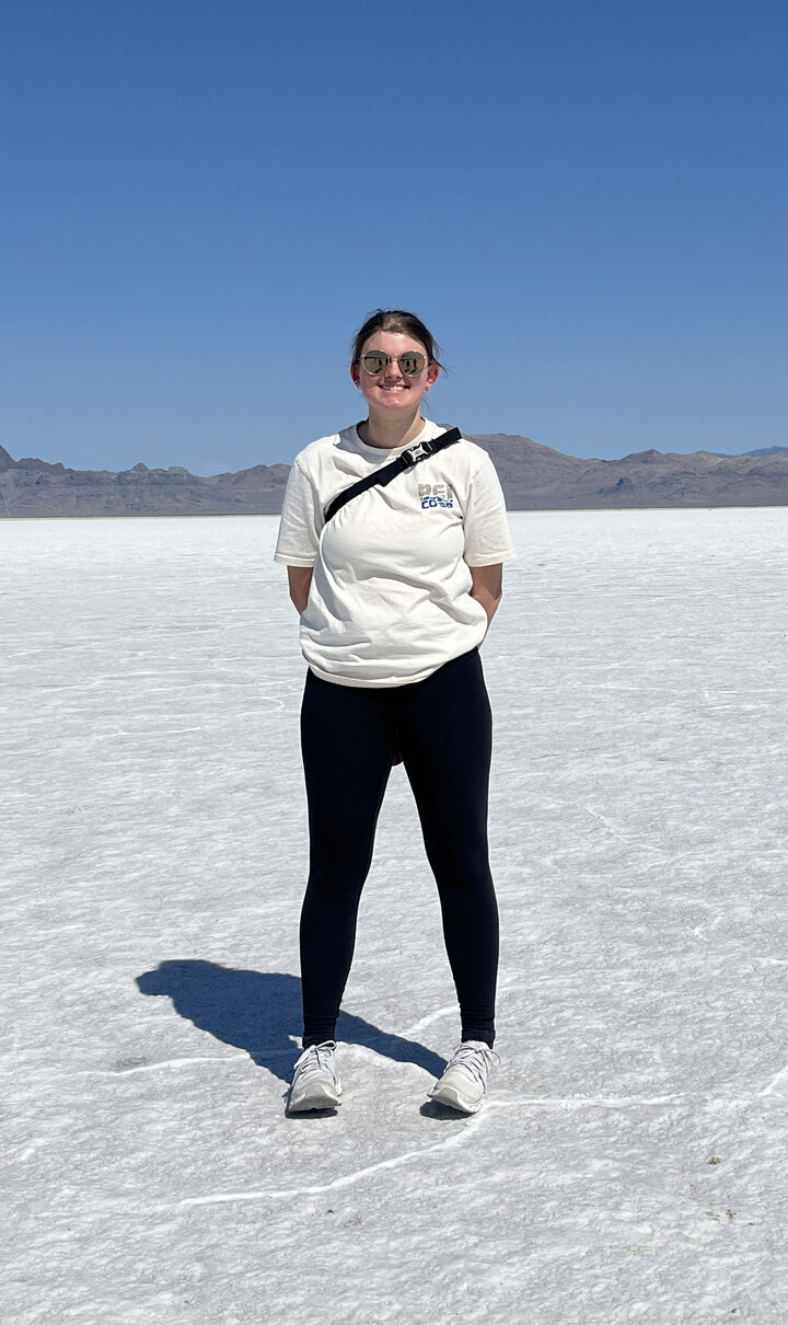 photo of Alexis Downs standing on white sand
