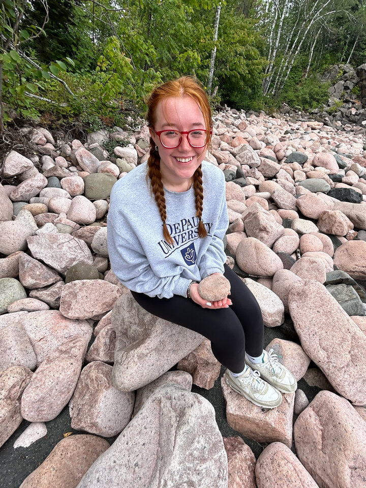 Enyssa sitting on rocks