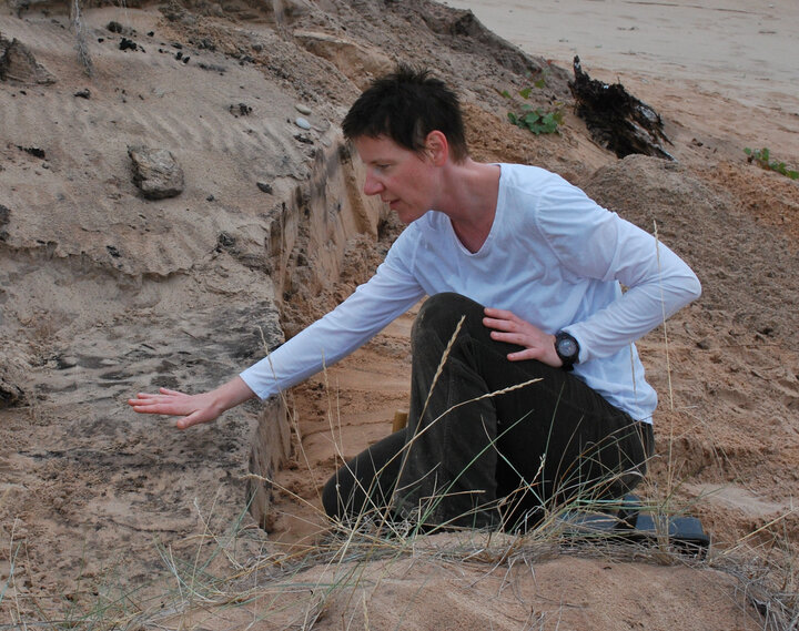 Gosha Mahoney examining a rock formation