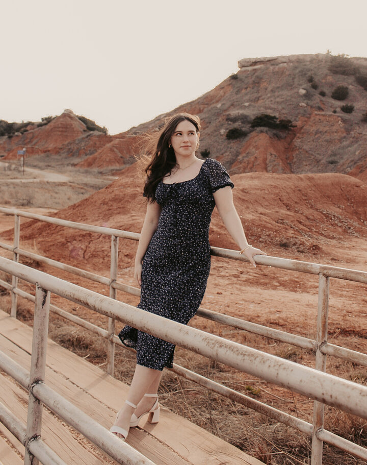 Christine Meadows standing o a bridge